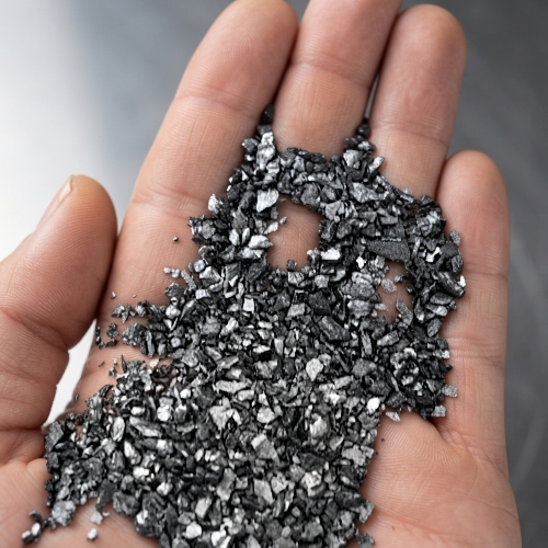 Close-up detail of the crystalline structure of Gas Calcined Anthracite (GCA).
